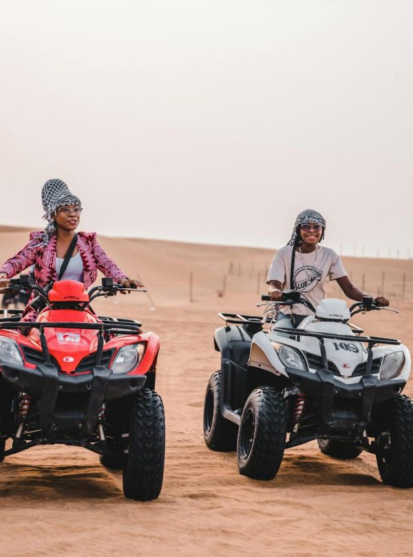 Mother and Son Riding Quads on Desert
